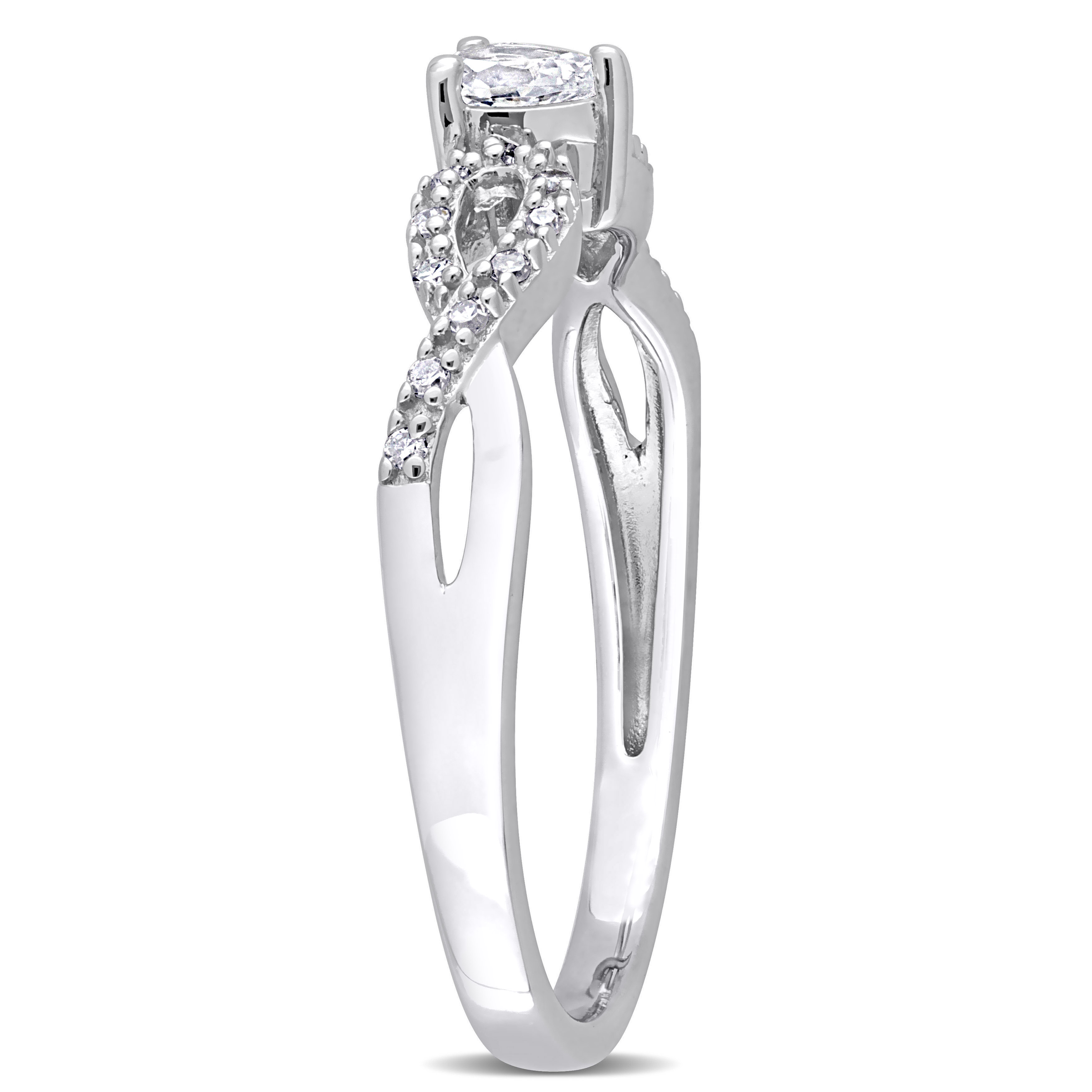 1/4 CT TGW Pear-Shaped Created White Sapphire and 1/10 CT TW Diamond Infinity Engagement Ring in Sterling Silver